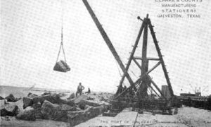 G-5925.1FF3-4 THE GALVESTON SEAWALL."  "DERRICK LAYING RIPRAP.  A 1500 LB. ROCK IN MIDAIR.