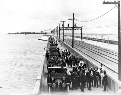 Photograph of procession stopped on driveway of newly opened causeway