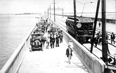 Photograph of procession making its way along driveway of newly opened causeway