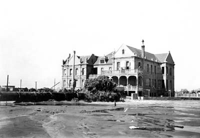 Grade Raising, Photograph labeled South Side of Home, Leviathan Discharging from Main Pipe 