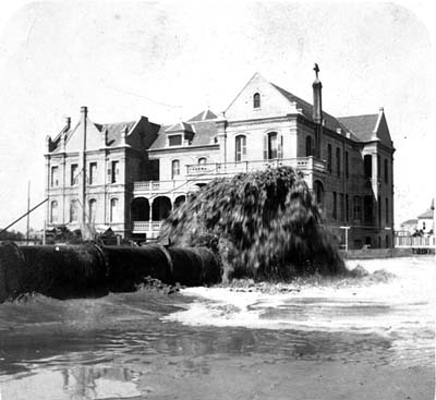 Grade Raising, Photograph labeled Leviathan's Discharge Pipe South Side of Woman's Home