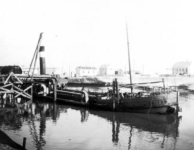 Photograph of dredge Triton moored in canal 