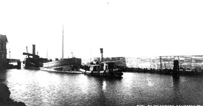 Photograph labeled Seawall, Dredge and Canal 