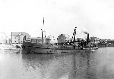Grade Raising, Photograph of dredge Nereus II discharging fill