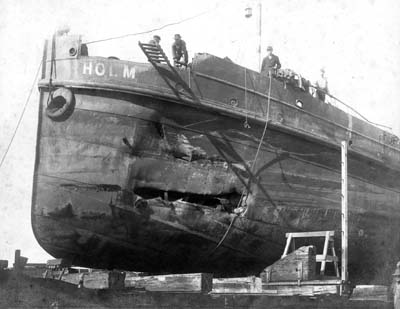 Grade Raising, Photograph of the dredge Holm in drydock 