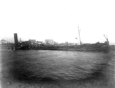 Grade Raising, Photograph of starboard view of dredge Holm following marine accident