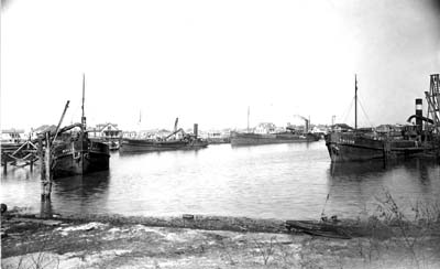 Grade Raising, Photograph labeled Four Dutch sand hopper dredges