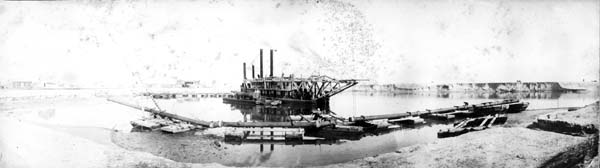 Grade Raising, Photograph labeled Dredge No. 6 taking out first cut turning basin