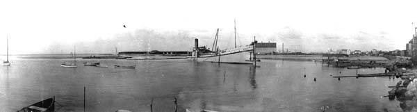 Grade Raising, Photograph of dredge Holm stationed in canal 