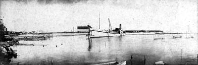 Grade Raising, Photograph labeled Holm connected from a hopper to a straight dredge