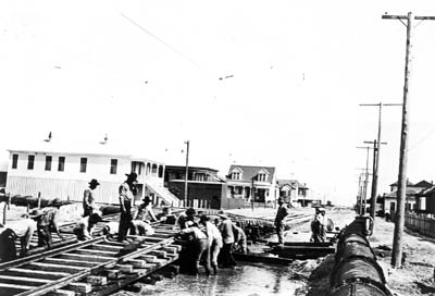 Grade Raising, Photograph of workmen raising streetcar tracks