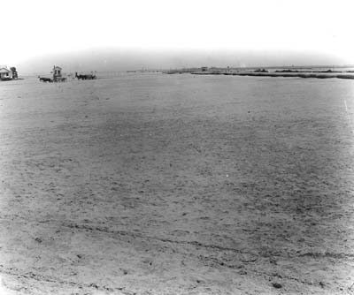 Grade Raising, Photograph of wagons in distance crossing newly-filled area