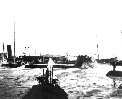 Grade Raising, Photograph of dredge discharging fill