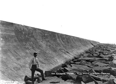 Seawall, Photograph of man posed standing on riprap