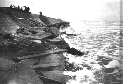 Seawall, Photograph of waves crashing against riprap