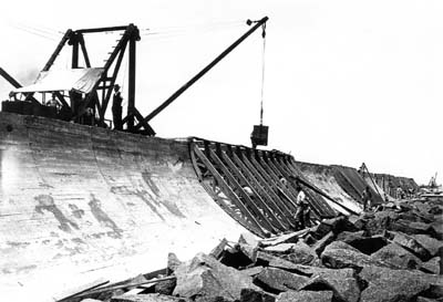 Photograph of mixer pouring concrete into wood caisson 