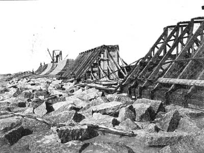 Photograph labeled The Galveston Seawall. Showing the first few sections 