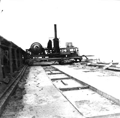 Seawall, Photograph of steam mixer pouring concrete for foundation 