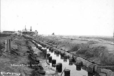 Seawall, Photograph labeled 5 ros of piling over which base is cast