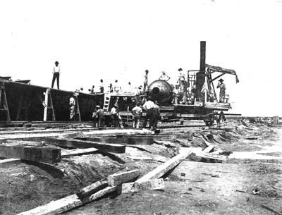 Seawall, Photograph labeled The 'little mixer' laying the foundation