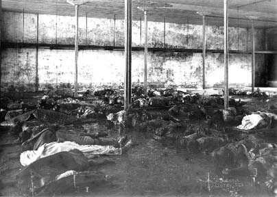 Photograph of bodies in makeshift morgue