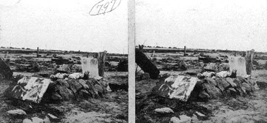 Stereo card of of makeshift grave covered with rocks