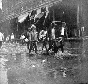 Photograph labeled Centre St. Carrying the dead while water was on