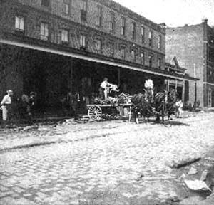 Photograph labeled Church St. Loading drays at morgue