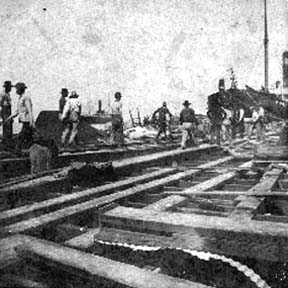 Photograph labeled Loaded with dead and 700 to bury[ed] at sea