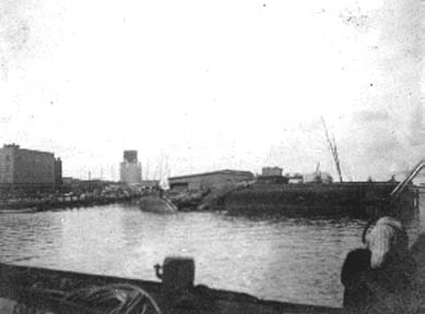 Photograph of capsized sailing vessels