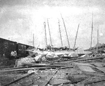 Photograph of capsized sailing vessels