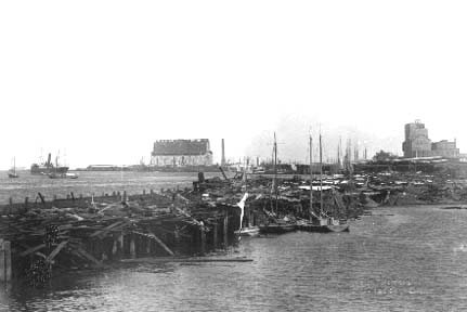Photograph of debris strewn along wharf