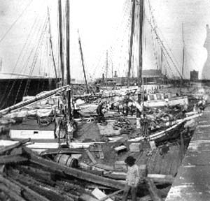 Photograph labeled Shipping from top of box car