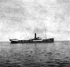 Photograph labeled Galv. Bay. Vessel stranded on the sand.