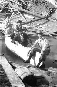 Photograph labeled Boat & Crew used during the flood