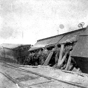 Photograph labeled 15 & wharf. Wrecked cars of wheat.