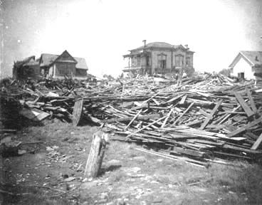 Photograph labeled Men at work searching for bodies