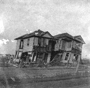 Photograph labeled 27 & P. Two Houses left near the Beach