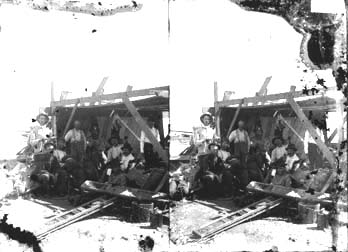 Stereo glass negative workmen taking break under lean-to shelter