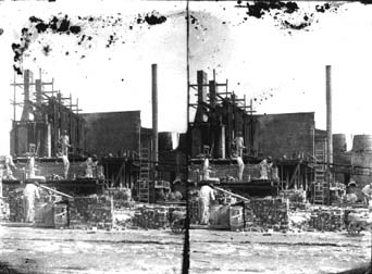 Stereo glass negative of brick layers at construction site