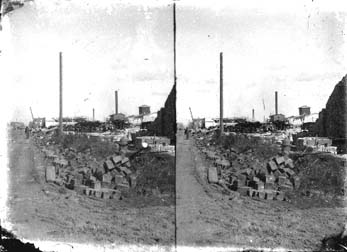 Stereo glass negative of debris and wrecked buildings
