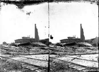 Stereo glass negative of railroad track and debris 
