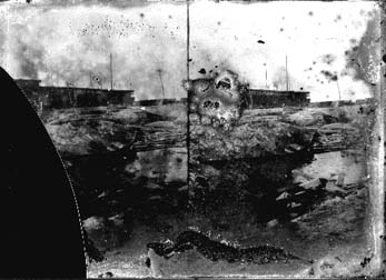 Stereo glass negative of debris and J. Moller & Co. Cotton Warehouse