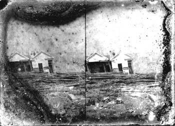 Stereo glass negative of wrecked houses