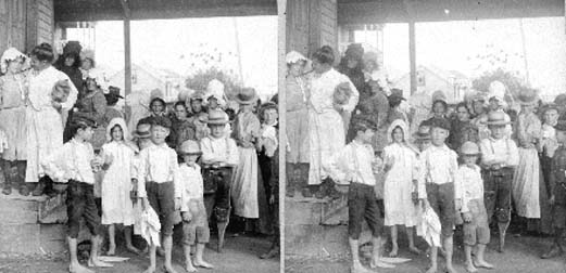 Stereo card of Red Cross workers and refugee children