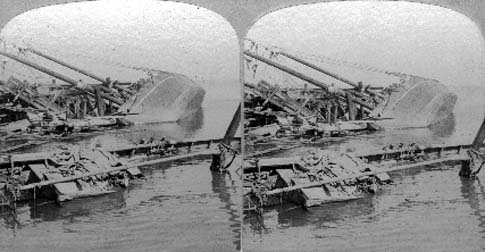 Stereo card labeled Galveston Disaster - Schooners upset in the harbor