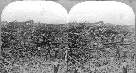 Stereo card labeled Searching for the Dead among the Ruins