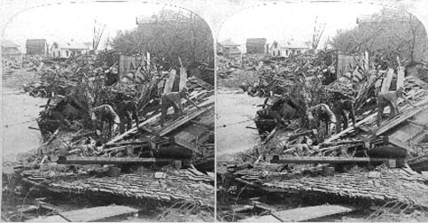 Stereo card labeled Recovering bodies from that awful chaos of Wreckage