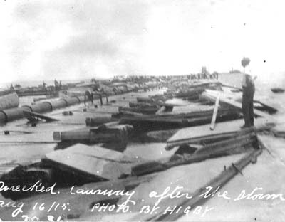 Photograph labeled wrecked causeway after the storm