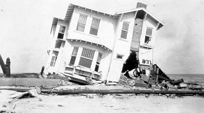 Photograph of wrecked two-story frame house on Seawall Boulevard 